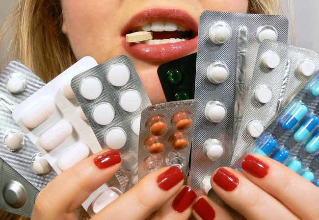 Woman Holding Pills